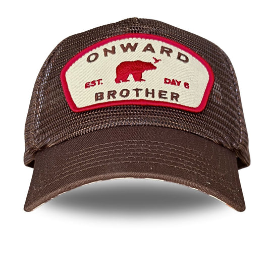 A brown mesh-back trucker cap with a curved brim, featuring a cream-colored front patch with a red border, a red bear graphic, and the text 'ONWARD BROTHER' and 'EST. DAY 6'.